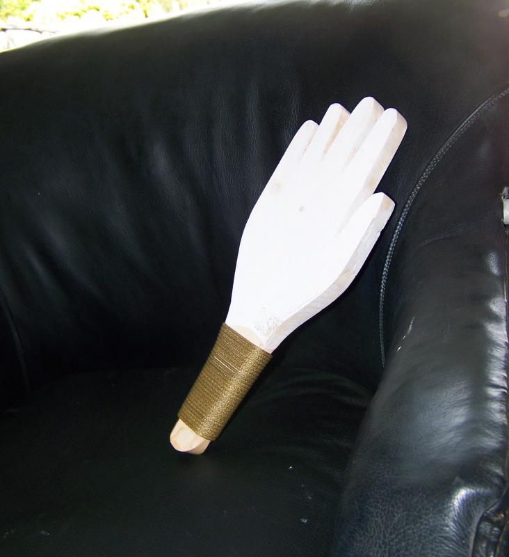 With no blinkers in the car, Cutler's passengers must use this wooden hand to signal turns. BY MATTHEW BERNAT